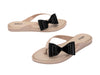 Melissa Flip Flop in beige with a cute flat bow design, stylish and comfortable slip-on footwear for women.