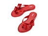 Melissa Flip Flop in red with a cute flat bow design, stylish and comfortable slip-on footwear for women.