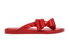 Melissa Flip Flop in red with a cute flat bow design, stylish and comfortable slip-on footwear for women.