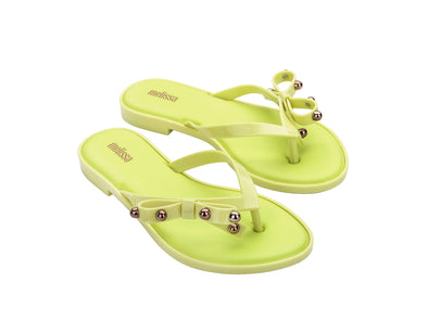 Melissa Flip Flop Slim II Bow Detail Yellow Beachwear Slipper for Women – Trendy and comfortable slim flip-flops with a stylish bow design, perfect for beach outings and casual wear.