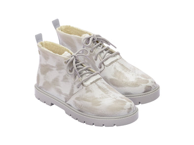 Melissa Fluffy Lace-Up Grey White Boot with faux fur lining, designed for both men and women. Features a lace-up closure and a comfortable low heel for a cozy, stylish winter look.