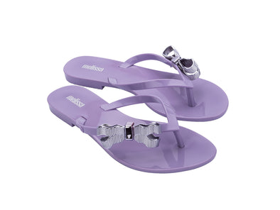 Melissa Harmonic Sweet V Flat Flip Flops Lilac Slippers for Women – Stylish and comfortable flat flip-flops with a chic bow detail, perfect for casual and everyday wear.