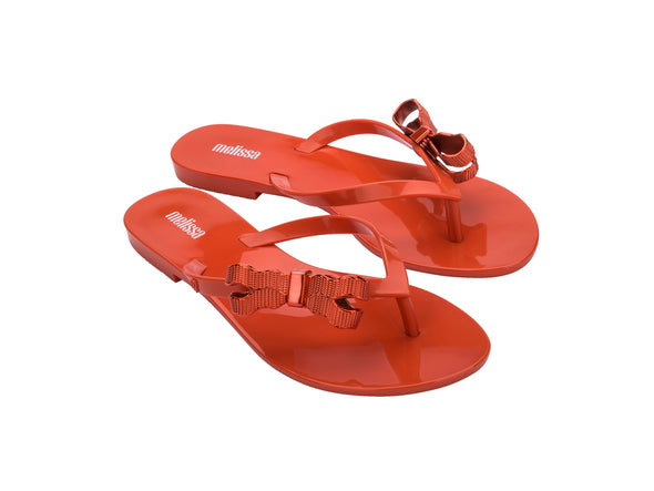 Melissa Harmonic Sweet V Flat Flip Flops Red Slippers for Women â€“ Stylish and comfortable flat flip-flops with a chic bow detail, perfect for casual and everyday wear.