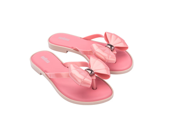 Melissa Slim flat pink flip flop with bow for women – stylish lightweight summer slipper offering comfort and feminine casual beachwear style