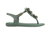 Melissa Solar Springtime flat flip-flops in green, featuring a delicate flower design, perfect for casual and outdoor wear.