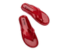 Melissa The Real Jelly Red Flip Flop Slippers – Stylish and water-resistant jelly slippers made from signature fruit-scented PVC, offering comfort and a bold red design for everyday wear.